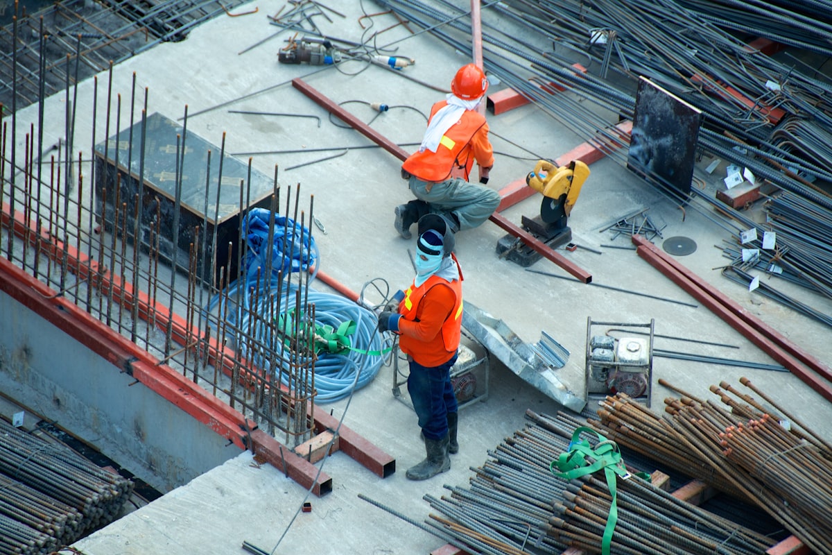 Construction site with temporary structures and equipment under a clear sky